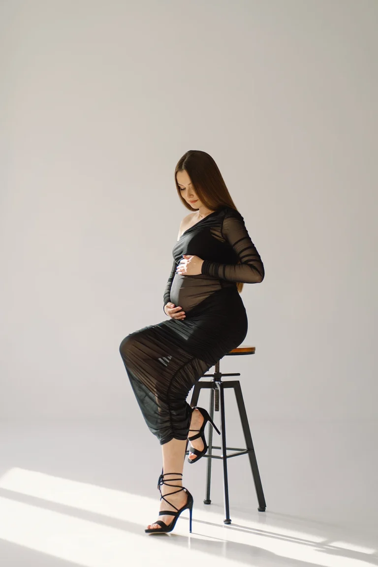 cute-young-pregnant-girl-sitting-on-the-white-stud-2023-11-27-05-32-45-utc